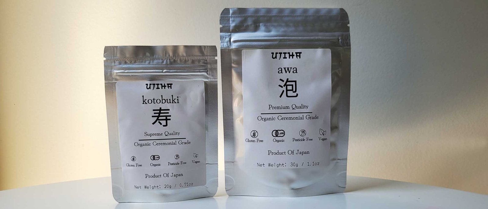 awa premium ceremonial grade matcha and kotobuki ceremonial grade matcha side by side